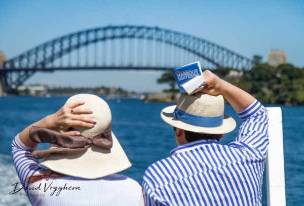 Tourists and the Harbour Bridge of Sydney, Australia